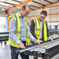 Thumbnail photo in factory showing aluminium profiles being insepcted